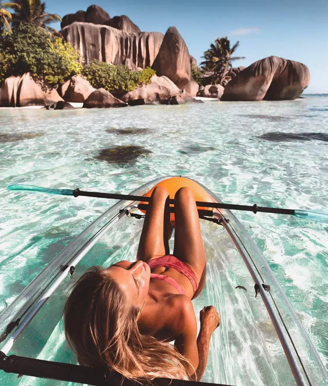 Clear water and reef beside the granite shore of La Digue